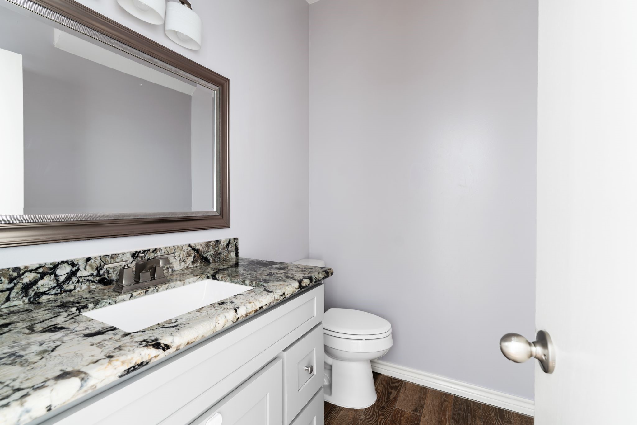 2612 Yupon Street Houston, TX 77006 - Photo 20 of 41 Downstairs powder bath features granite countertops, fresh paint, and convenient access for guests.