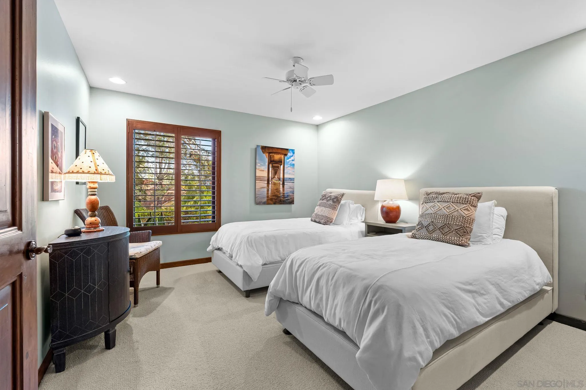 2969 Racetrack View Drive Del Mar, CA 92014 - Photo 35 of 59 a bedroom with a bed and a chandelier