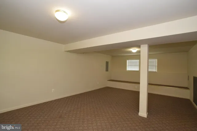 an empty room with a empty space and window