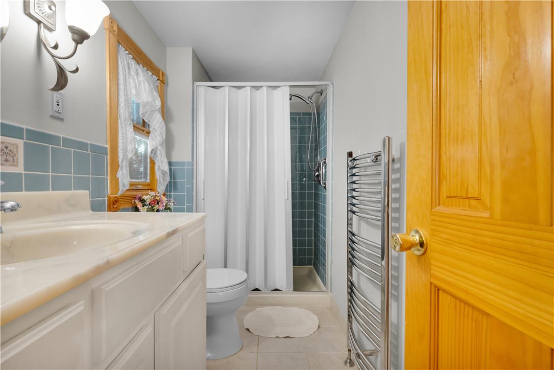 3915 Hecktown Road Bethlehem, PA 18020 - Photo 26 of 42 A classic tiled wainscoting complements the warm wood window trim and solid panel door.