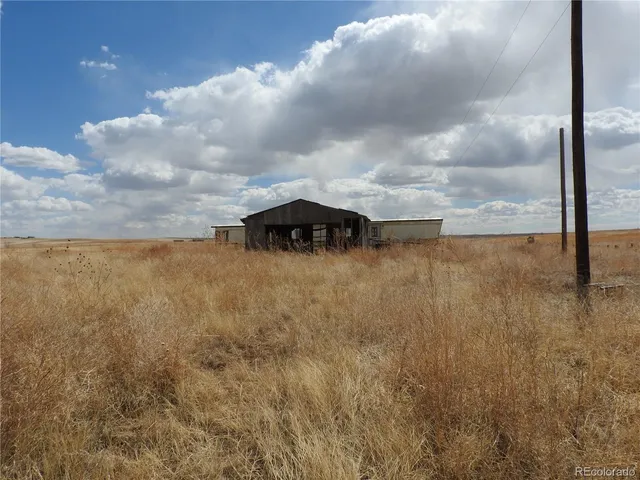 a view of a town with mountains in the background