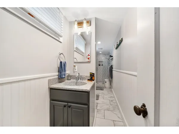 a bathroom with a sink and mirror