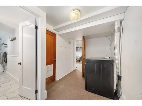 a view of a hallway and interior of the house