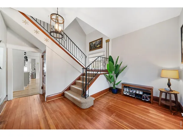 a view of entryway with wooden floor