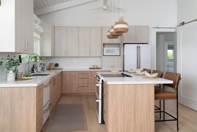 a kitchen with a sink and cabinets
