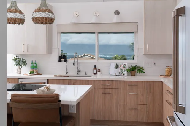 a kitchen with a sink cabinets and window
