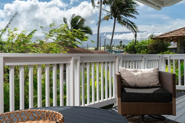 a view of balcony with furniture