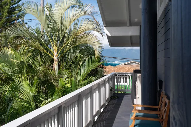 a view of a house with wooden deck