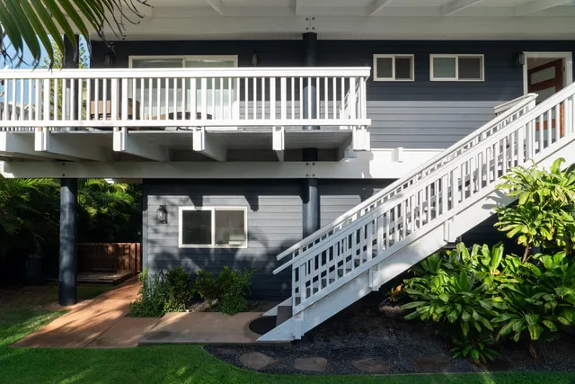 a view of a house with a yard and plants