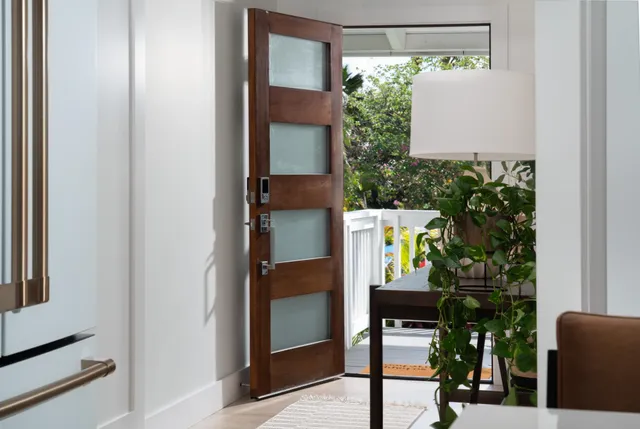 a view of a house with pool and sitting area