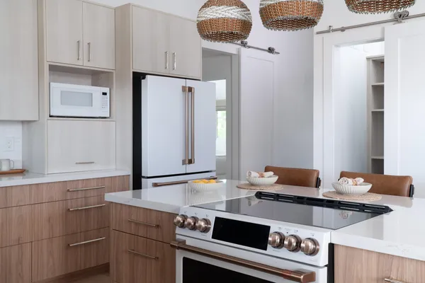 a kitchen with stainless steel appliances a stove and a refrigerator