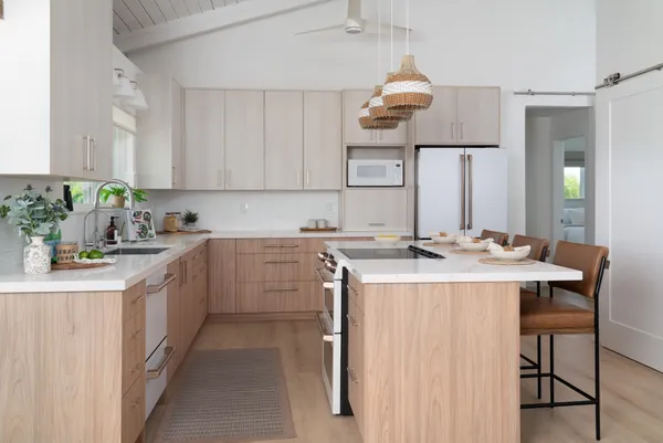 a kitchen with a sink and cabinets