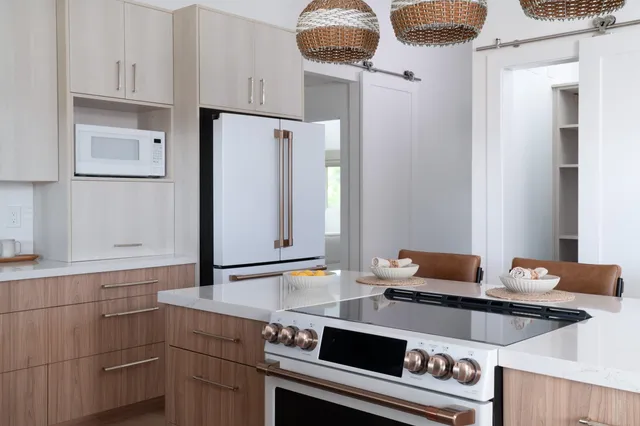 a kitchen with stainless steel appliances a stove and a refrigerator