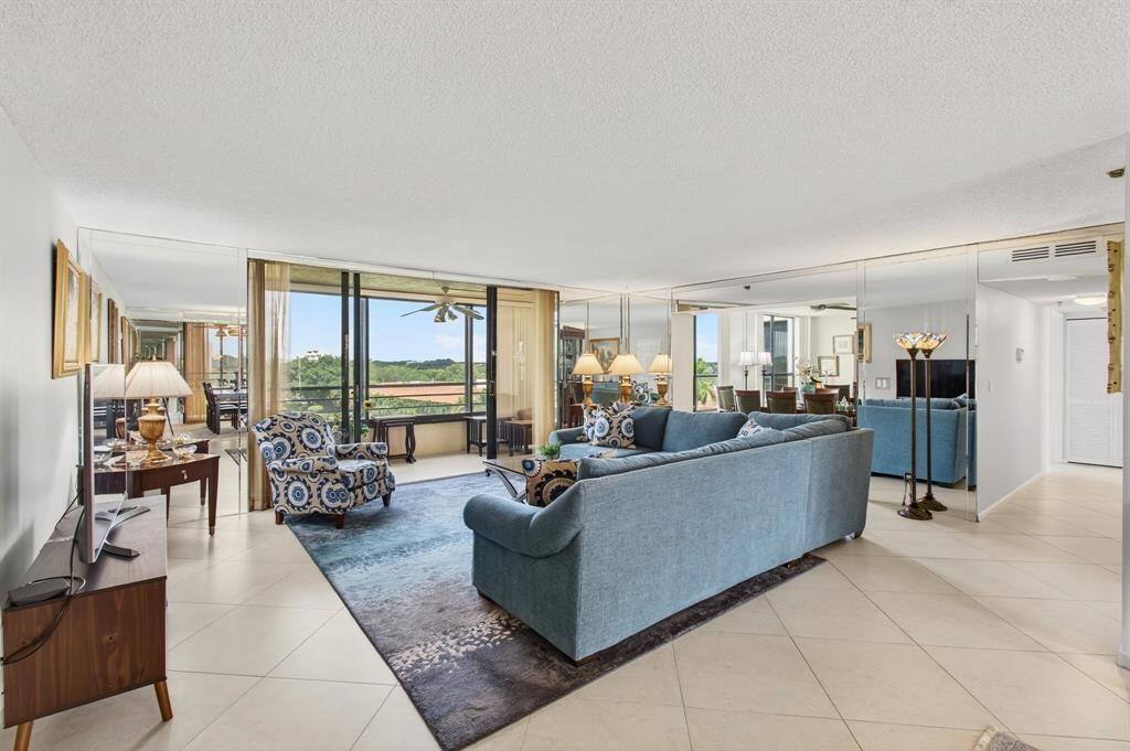 7145 Promenade Drive, Unit 602 Boca Raton, FL 33433 - Photo 11 of 90 a living room with furniture and a large window