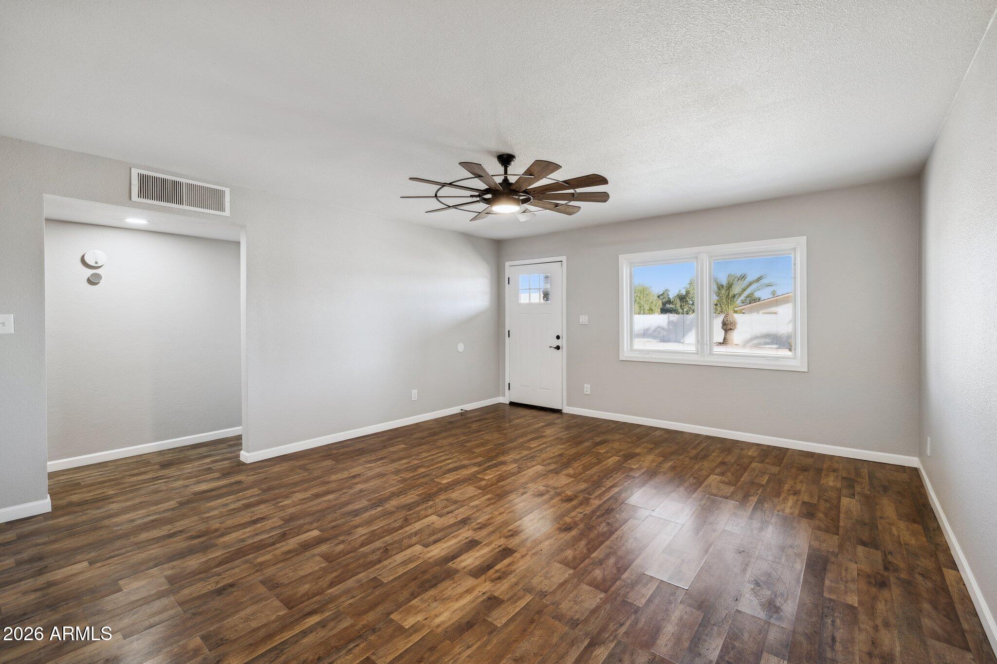 13002 North 28th Place Phoenix, AZ 85032 - Photo 13 of 42 a view of an empty room with a window