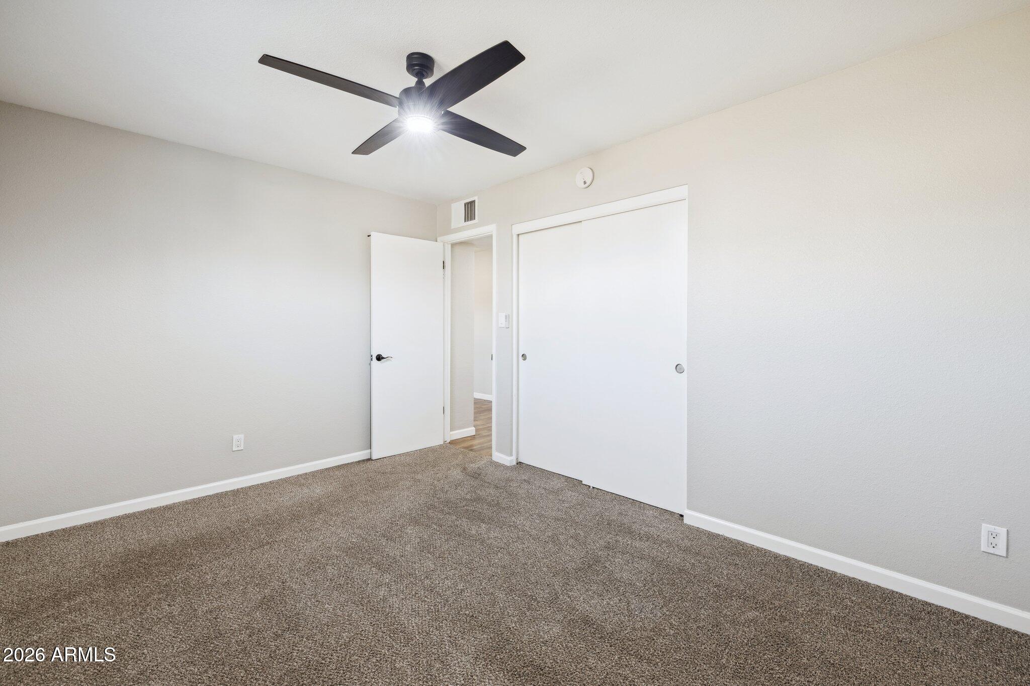 13002 North 28th Place Phoenix, AZ 85032 - Photo 30 of 42 a view of a ceiling fan in a room