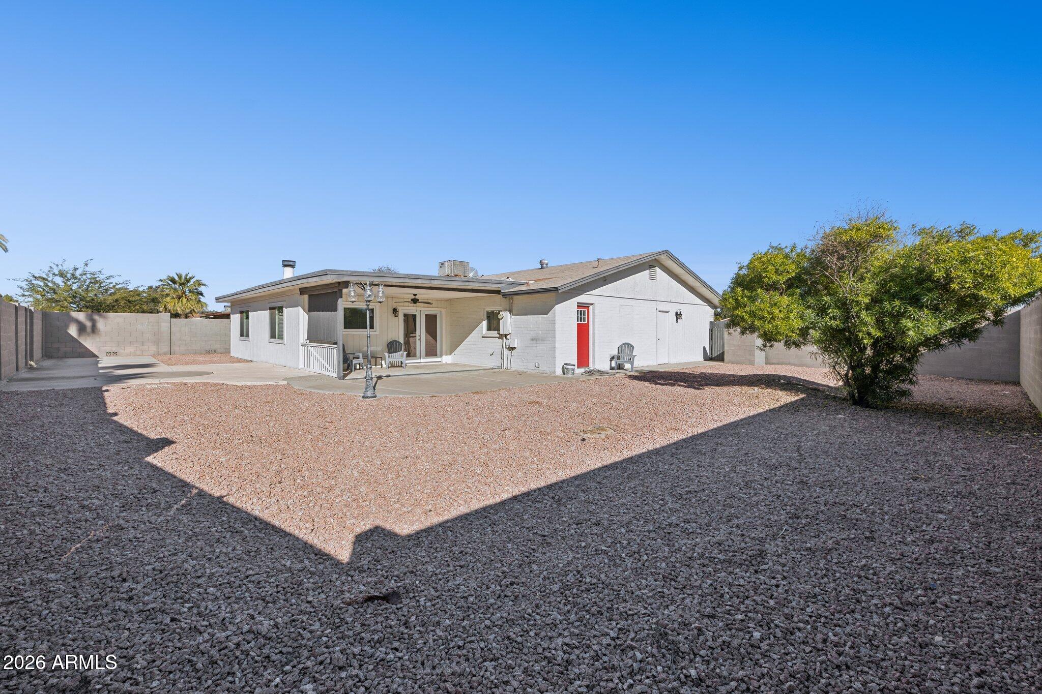 13002 North 28th Place Phoenix, AZ 85032 - Photo 34 of 42 a view of a house with a yard