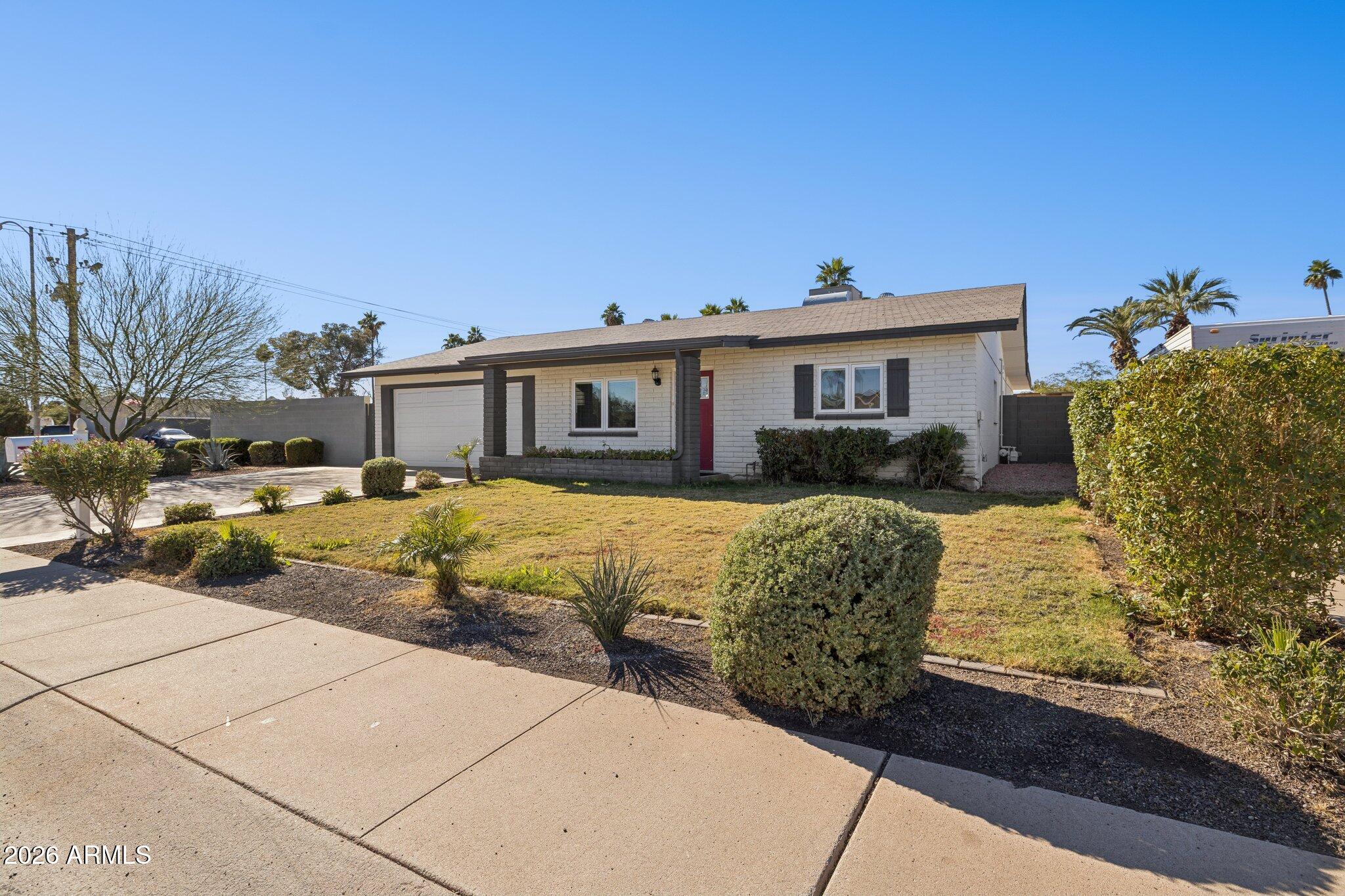 13002 North 28th Place Phoenix, AZ 85032 - Photo 4 of 42 a view of a house with a yard
