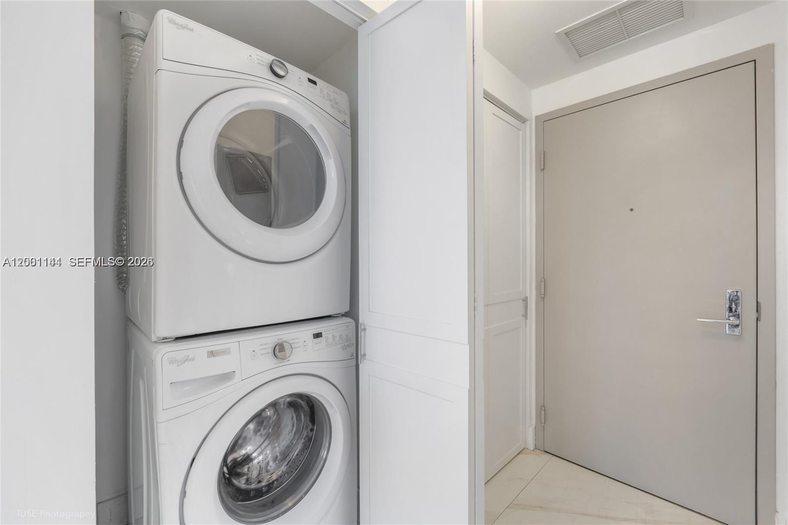 488 Northeast 18th Street, Unit 505 Miami, FL 33132 - Photo 4 of 12 a utility room with dryer and washer