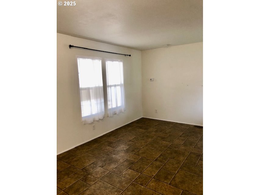 1475 Green Acres Road, Unit 76 Eugene, OR 97408 - Photo 6 of 23 a view of an empty room with a window