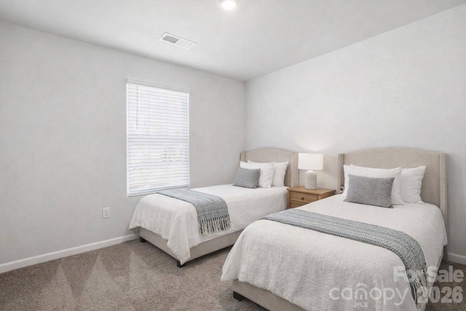 907 Morien Street Richburg, SC 29729 - Photo 22 of 28 a bedroom with two beds and a night stand