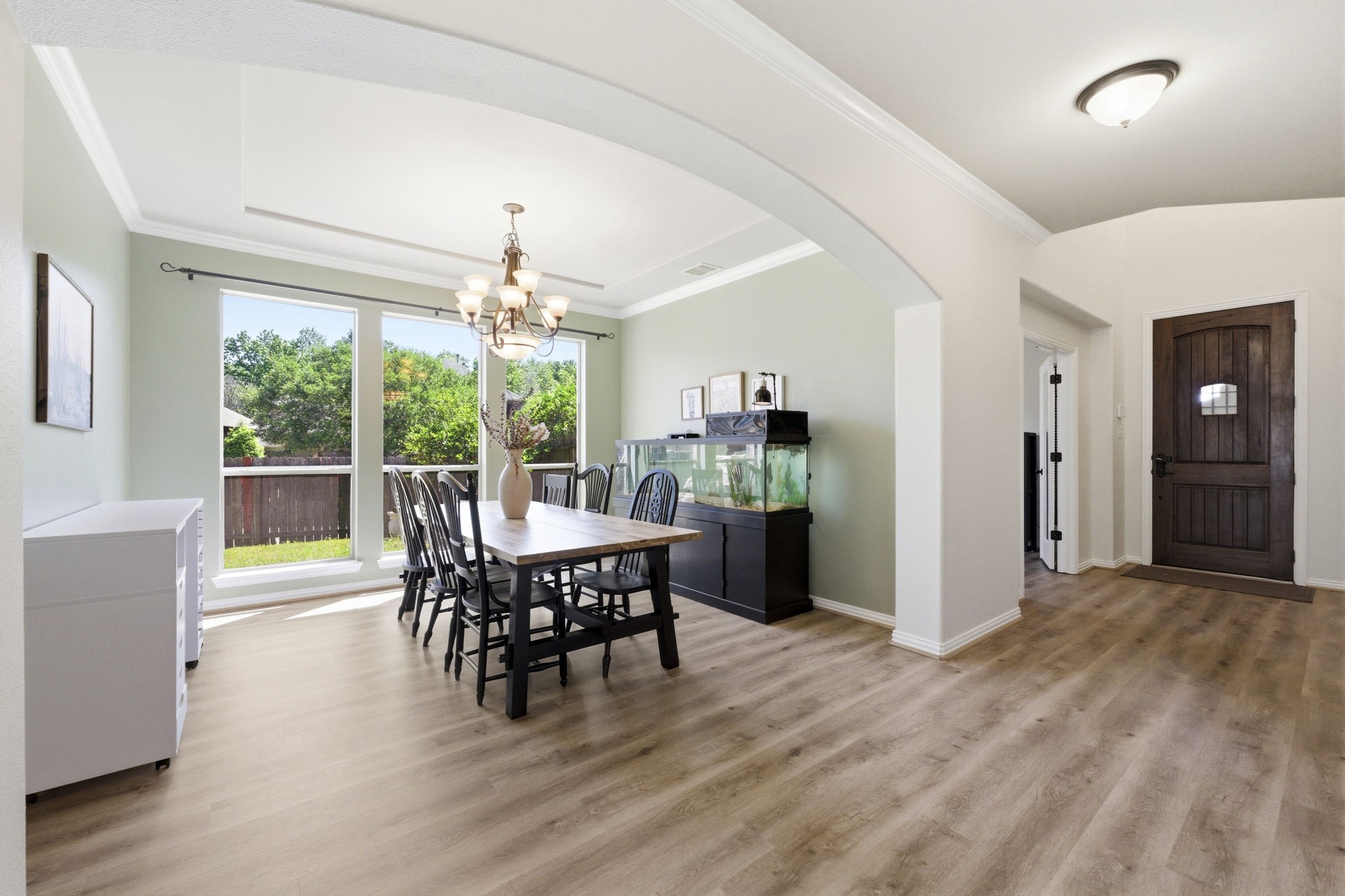 27502 Chris Ridge Court Spring, TX 77386 - Photo 5 of 37 Bright dining area with large windows, offering natural light and a view of the backyard.