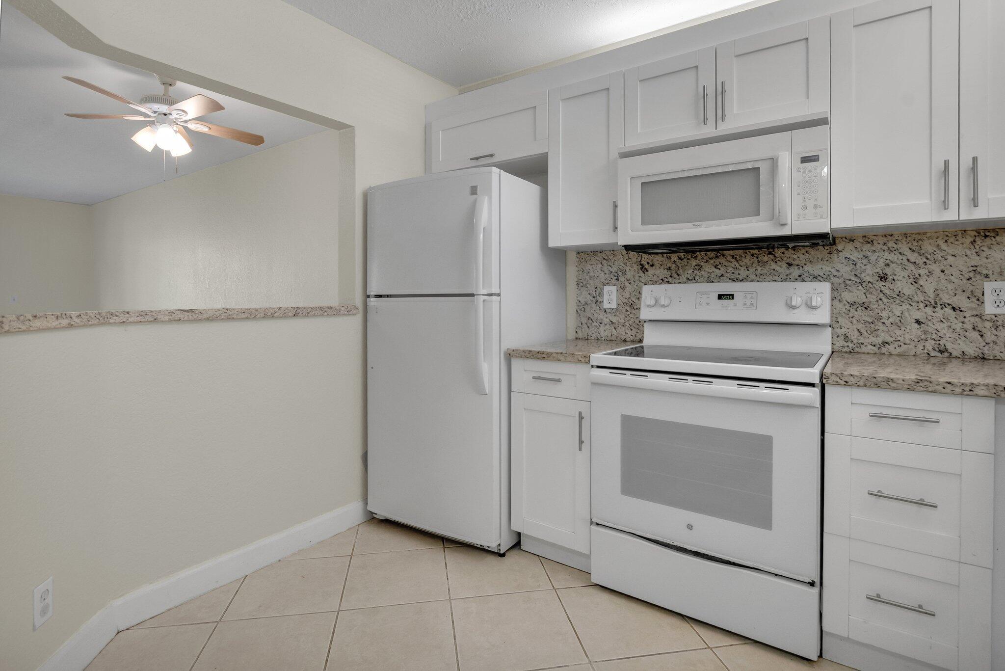 21911 Lake Forest Circle, Unit 103 Boca Raton, FL 33433 - Photo 8 of 24 Kitchen view 3