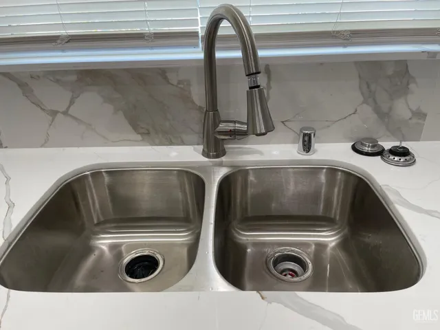 a close view of sink and washer