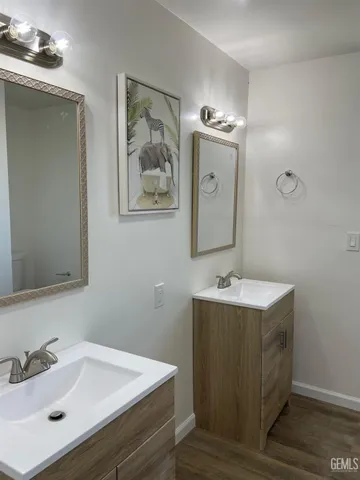 a bathroom with a sink and mirror