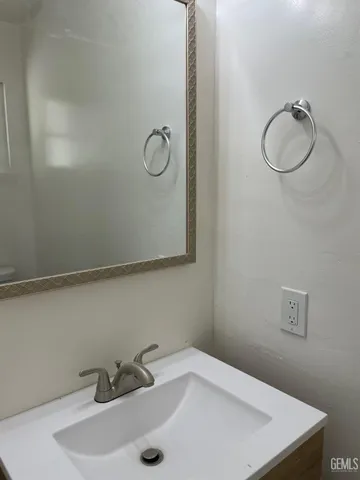 a bathroom with a sink and a vanity