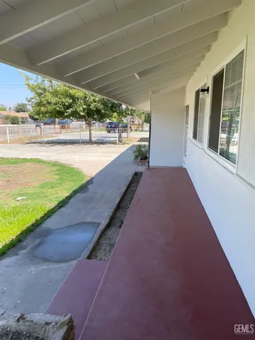 a view of a swimming pool with an outdoor seating