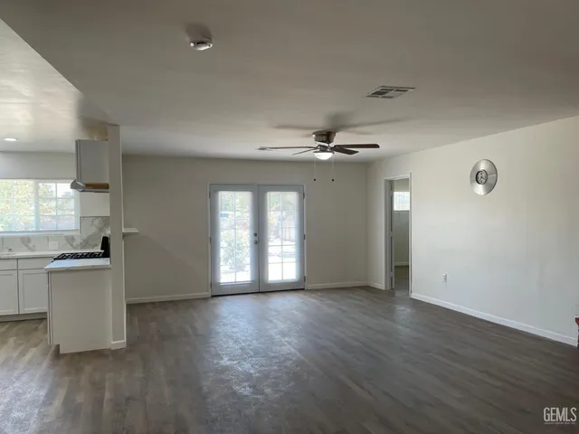 a view of a kitchen and a stove top oven