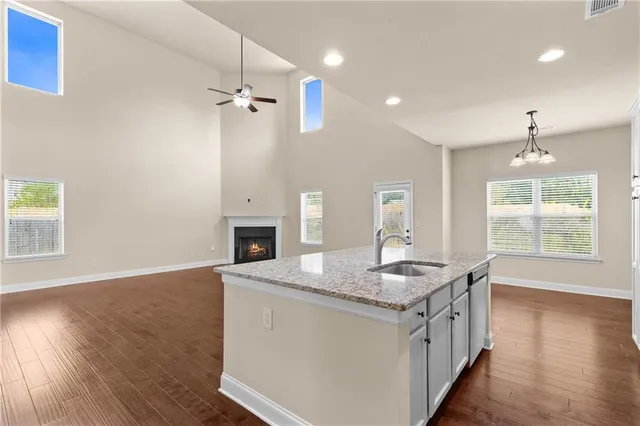 a kitchen with refrigerator and cabinets