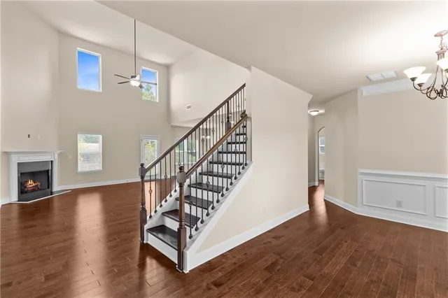 a view of entryway and hall with wooden floor