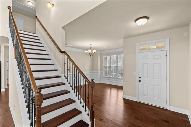 a view of entryway with wooden floor