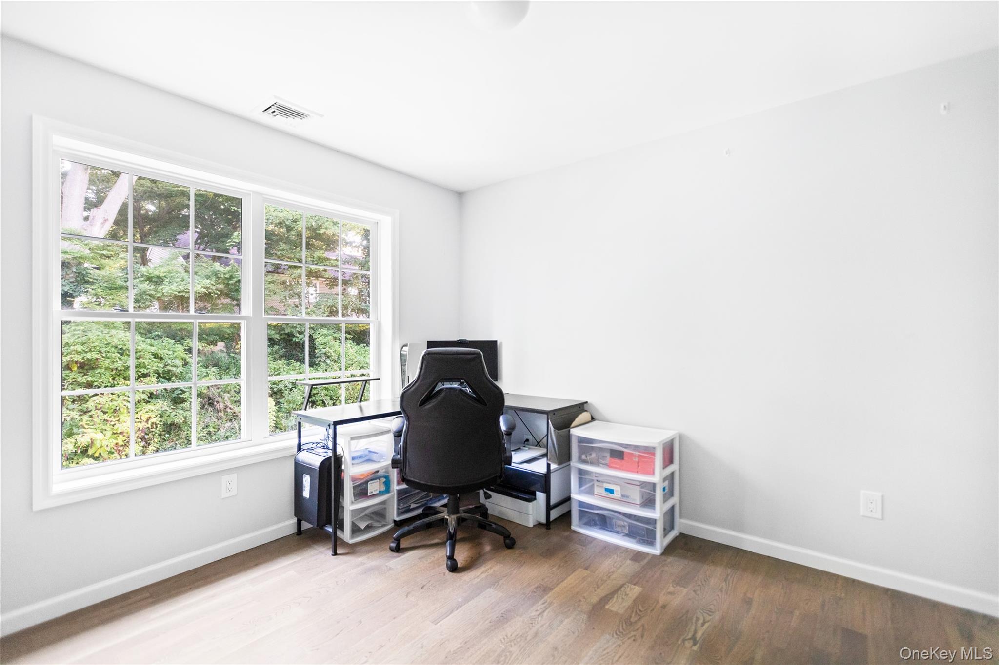 24 Belmont Road Sound Beach, NY 11789 - Photo 17 of 23 a view of a workspace with furniture and a window