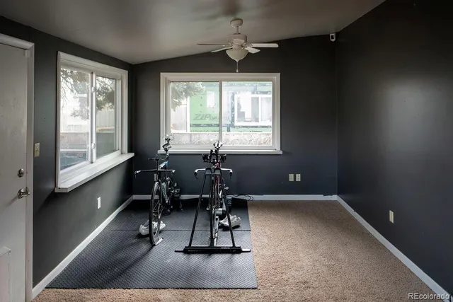 a work room with windows and wooden floor
