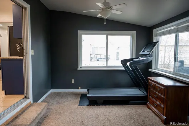 a living room with furniture and windows
