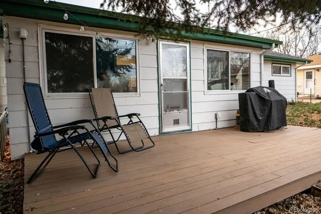 a view of two chairs in the patio