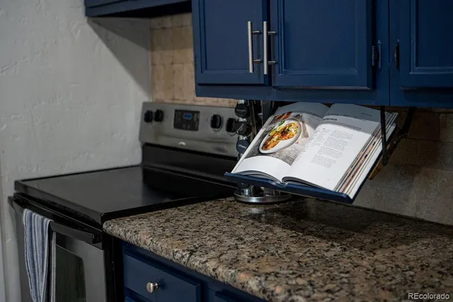 a view of water heater and wooden cabinets
