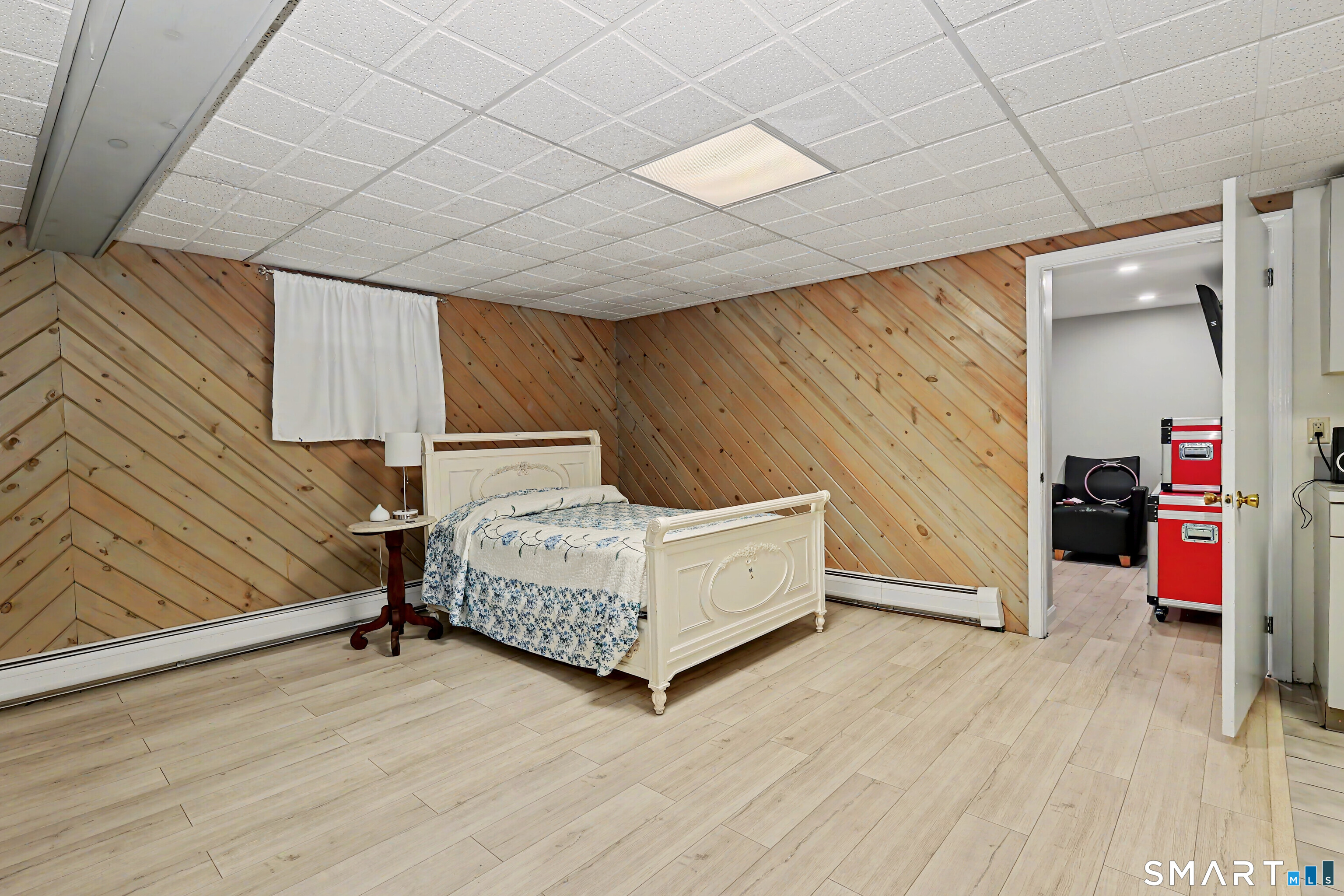 44 Haverhill Road Trumbull, CT 06611 - Photo 25 of 32 a bedroom with a bed and a wooden floor