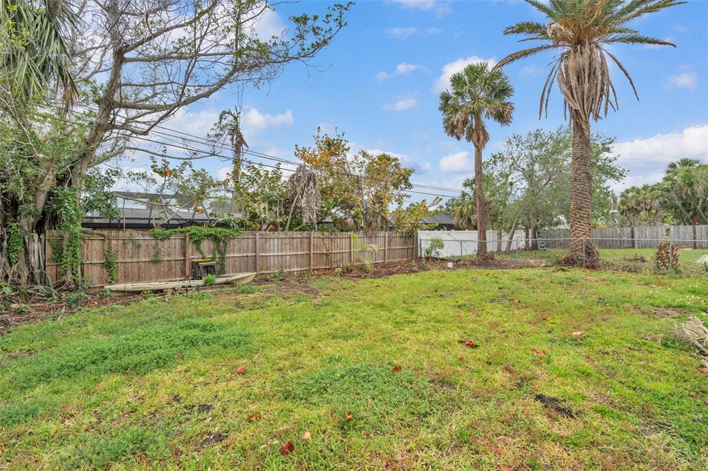 752 Lantana Avenue Clearwater Beach, FL 33767 - Photo 5 of 7 a view of a yard with a house and a big yard