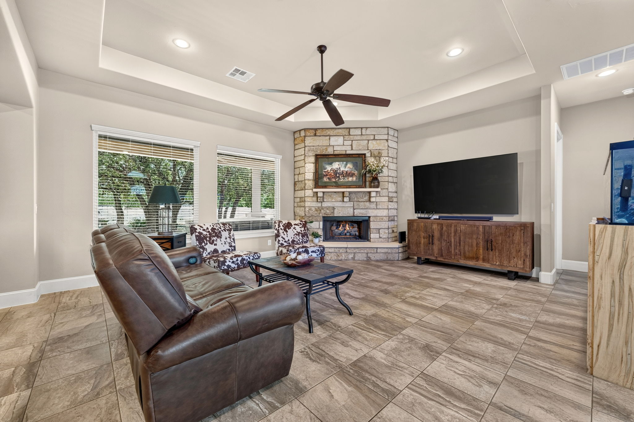 105 Coopers Hill Road Georgetown, TX 78633 - Photo 12 of 40 a living room with furniture and a flat screen tv
