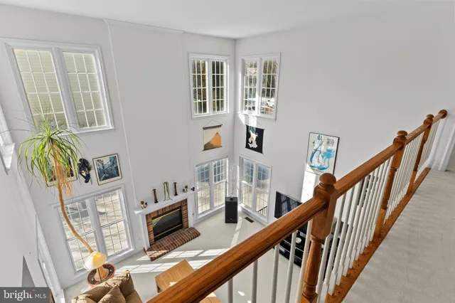 a spacious bedroom with a bed and a chandelier