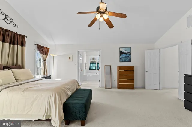 a white bath tub sitting next to a window