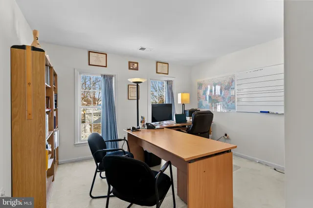 a view of hallway with windows