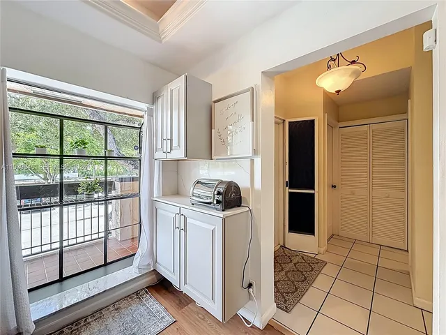 a kitchen with stainless steel appliances a stove microwave and sink