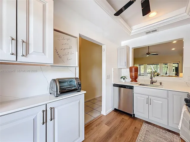 a bathroom with a sink a mirror and shower