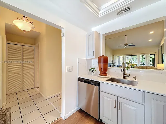 a spacious en suite bathroom with double vanity and a mirror