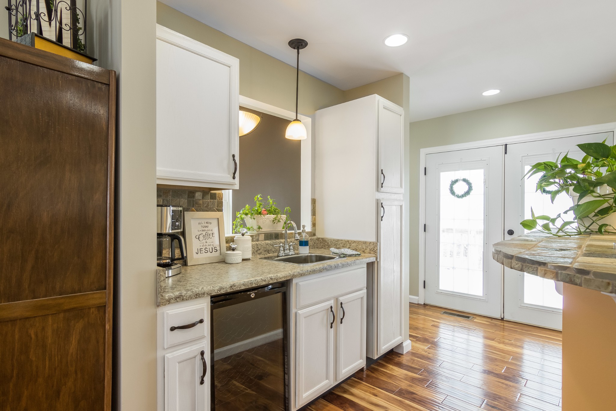 325 Osborne Road Watertown, TN 37184 - Photo 13 of 31 a kitchen with kitchen island granite countertop a sink and refrigerator